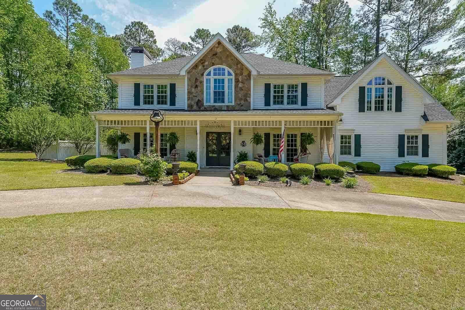 Photo one of 12 Blackfoot Trl Sharpsburg GA 30277 | MLS 10506782G