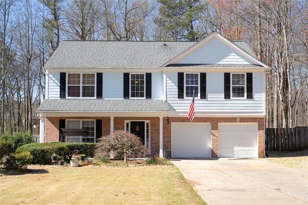 Photo one of 5770 Millstone Dr Cumming GA 30028 | MLS 7541891F