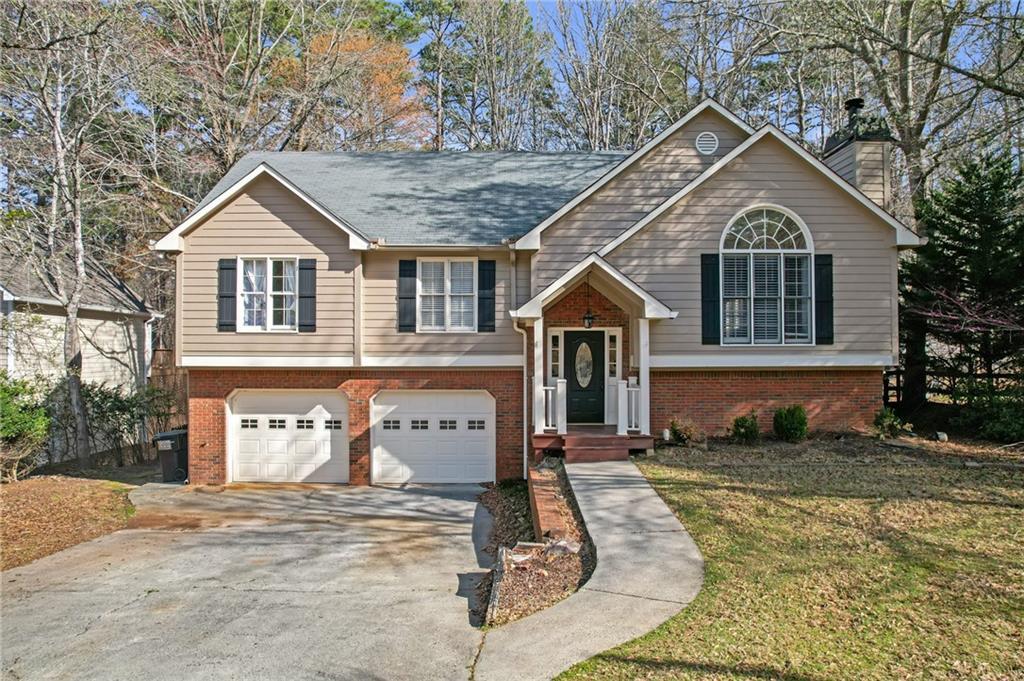 Photo one of 4142 Huntcliff Dr Woodstock GA 30189 | MLS 7543698F