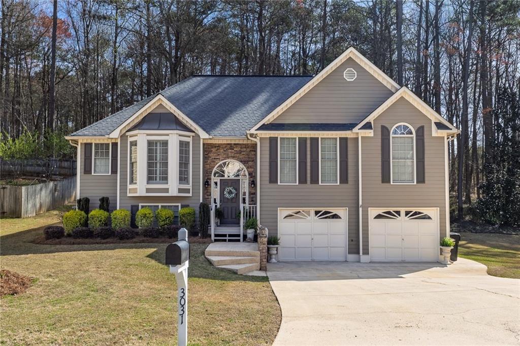 Photo one of 3031 Clove Tree Ln Woodstock GA 30189 | MLS 7543916F