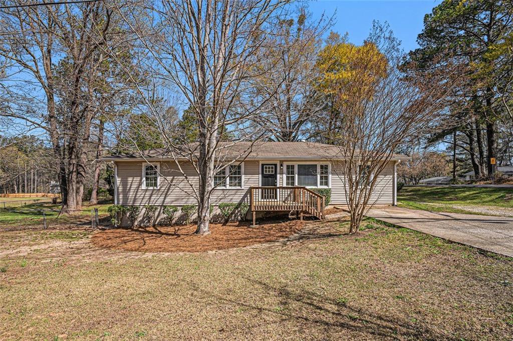 Photo one of 10164 Sunny Sw Dr Covington GA 30014 | MLS 7547927F