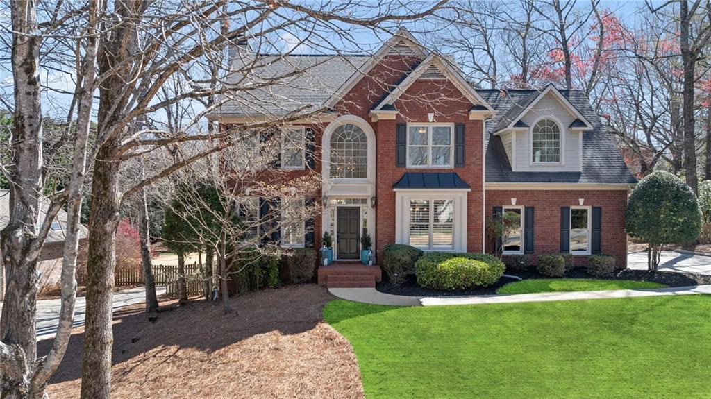 Photo one of 720 Lakeglen Dr Suwanee GA 30024 | MLS 7561852F