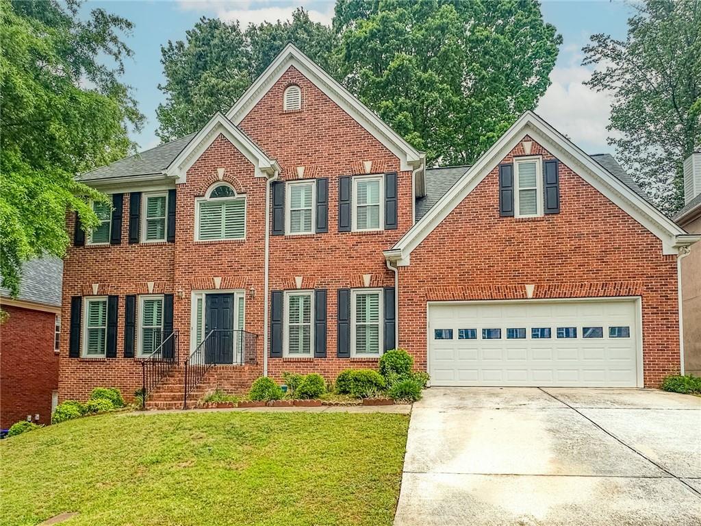 Photo one of 1485 Oglethorpe Run Ln Suwanee GA 30024 | MLS 7567696F