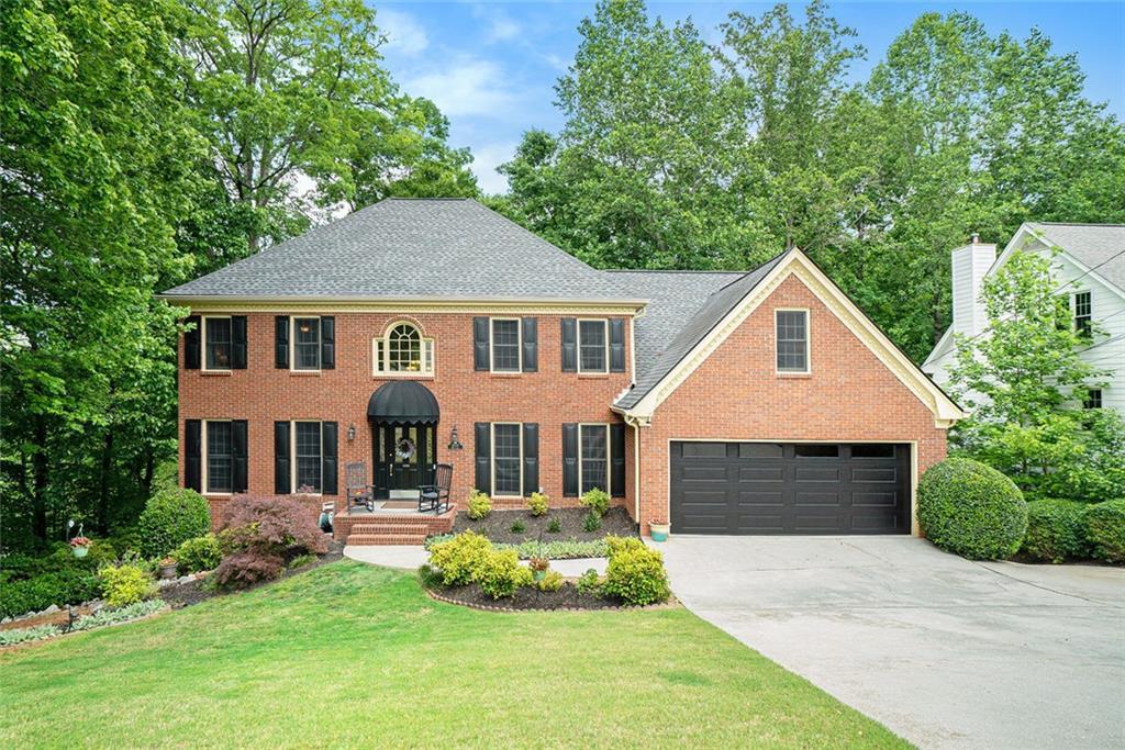 Photo one of 5020 Huntshire Sw Ln Lilburn GA 30047 | MLS 7571327F