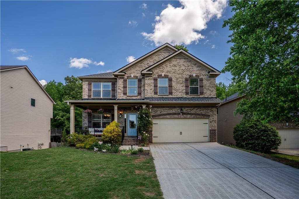 Photo one of 5655 Hedge Brook Dr Cumming GA 30028 | MLS 7573445F