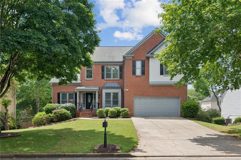 Photo one of 11040 Regal Forest Dr Johns Creek GA 30024 | MLS 7573563F