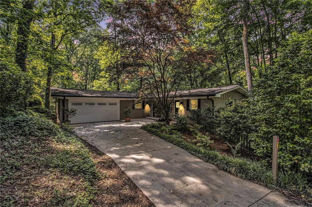 Photo one of 6590 Williamson Ne Dr Atlanta GA 30328 | MLS 7578268F