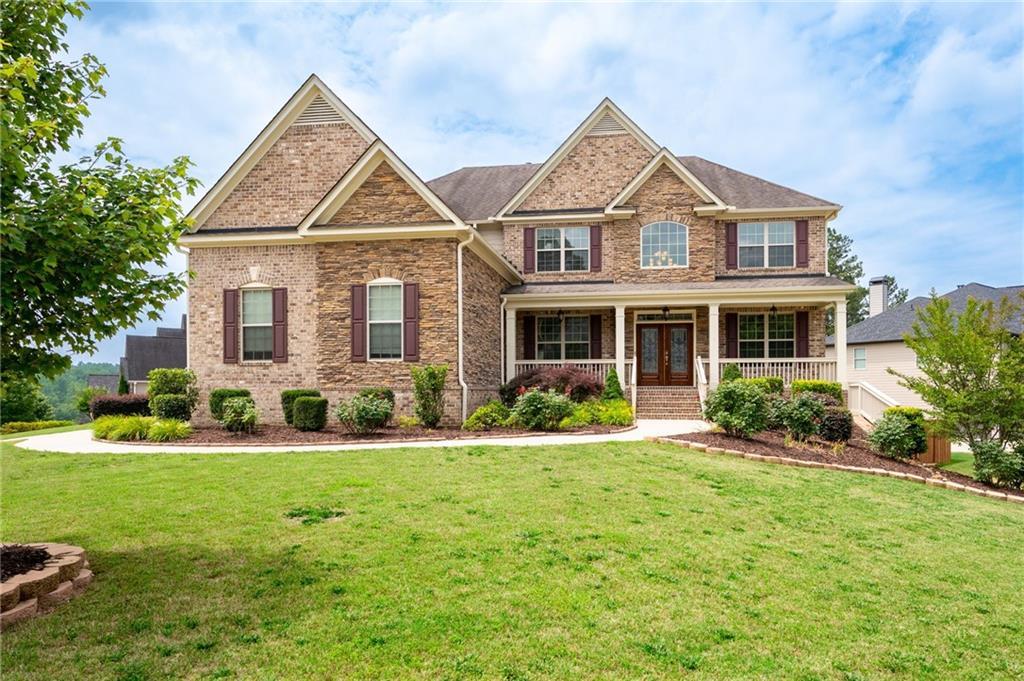 Photo one of 6585 Canyon Cv Cumming GA 30028 | MLS 7586687F