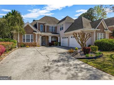 Charming home featuring a well-manicured lawn, beautiful landscaping, and a spacious driveway at 269 Legends Trce, Mcdonough, GA 30253