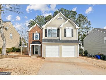 Two-story house with brick and siding exterior, two-car garage, and landscaping at 4248 Brighton Nw Way, Kennesaw, GA 30144