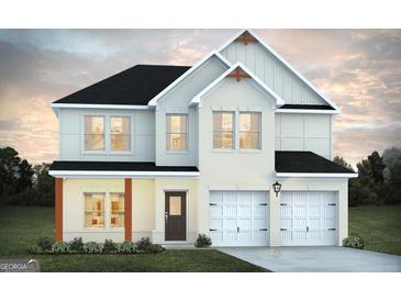 Charming two-story home with a white brick exterior and a two-car garage, showcasing a modern design at 189 Orwell Dr # 47, Social Circle, GA 30025