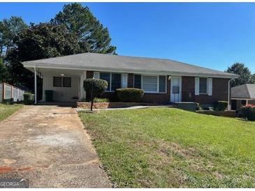 Charming single-story home with a well-manicured lawn and cozy curb appeal, inviting you to call it home at 2704 Gresham Se Rd, Atlanta, GA 30316