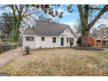 Charming, cottage-style home featuring a newly painted exterior, landscaped yard, and mature shade trees at 2013 Marco Dr, Decatur, GA 30032