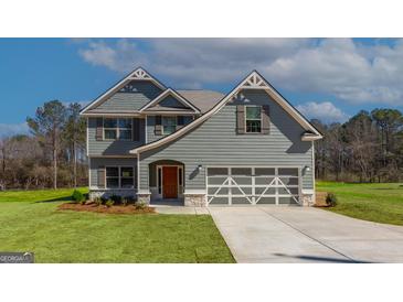 Beautiful two-story home with gray siding, stone accents, and a two-car garage at 527 Bohannon Rd # 12, Grantville, GA 30220