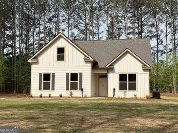 Charming single-Gathering home showcasing a well-manicured lawn and inviting facade at 1547 South Bethany Rd, Locust Grove, GA 30248