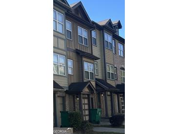 Three-story townhouses with brick and siding exteriors at 2809 Hillside Way, Decatur, GA 30034