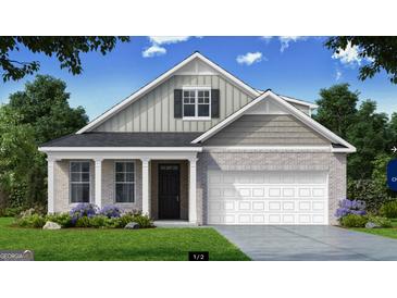 Two-story craftsman style home with gray siding and brick accents at 603 Parnassus Rd, Locust Grove, GA 30248