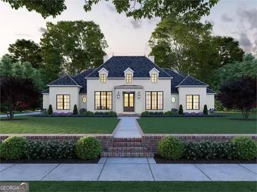 Elegant two-story home with a manicured lawn and brick walkway at 0 Matteo Way # 12, Fayetteville, GA 30215