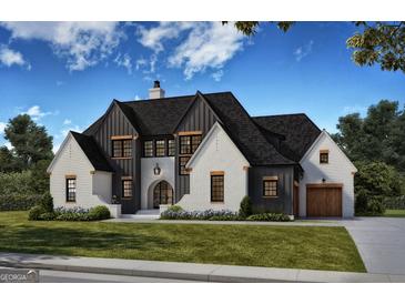 Two-story home with white brick and black accents, featuring a stylish design and landscaping at 0 Matteo Way # 14, Fayetteville, GA 30215