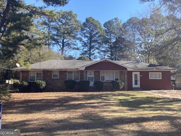 Brick ranch house with a large yard and mature trees at 5324 Crystal Ln, Atlanta, GA 30349