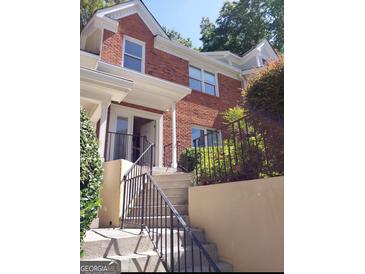 Brick townhouse exterior with steps and railing at 13 Forest Ridge Ct, Sandy Springs, GA 30350