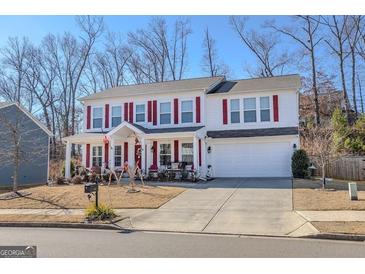 Two-story house with red shutters, front porch, and attached garage at 236 Augusta Walk, Canton, GA 30114