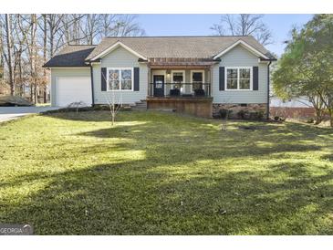 Charming craftsman style home with a covered porch and well-manicured lawn at 3213 Woodlynne Way, Atlanta, GA 30340