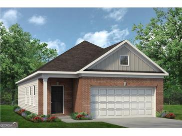 Brick ranch house with a two-car garage and landscaping at 1473 Trellis Court (Lot 4), Hampton, GA 30228