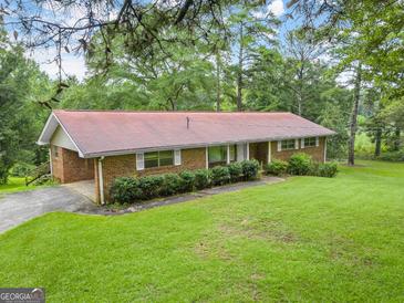Brick ranch house with large yard at 200 Old Stagecoach Dr, Stockbridge, GA 30281
