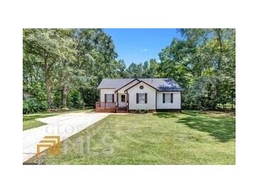 Charming one-story house with a spacious lawn and driveway at 6350 Park St, Union City, GA 30291