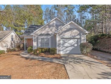 Charming single Gathering home with attached garage, mature landscaping, and a concrete walkway at 3700 Mays Sw Xing, Atlanta, GA 30331