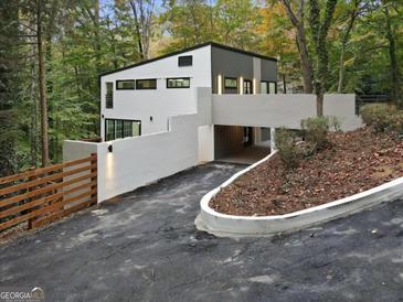 Modern two-story home with sleek design and private driveway at 1153 Dawn View Nw Ln, Atlanta, GA 30327