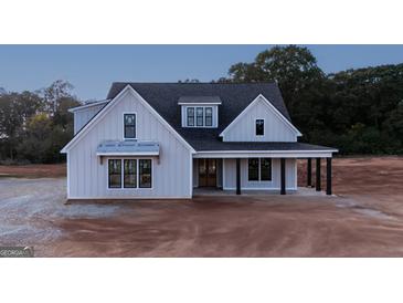 Two-story house with gray siding, black accents, and a covered porch at 175 Paislee Park (Lot # 12 Paislee Park) Dr, Fayetteville, GA 30215