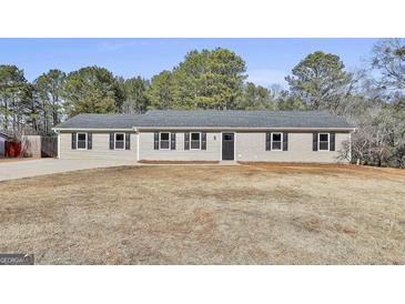 Newly built single-story home with a large yard at 234 Willis Rd, Sharpsburg, GA 30277