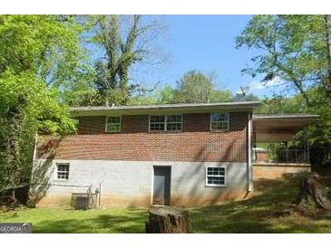 Brick ranch house with a large backyard and partial basement at 2176 Lilac Ln, Decatur, GA 30032