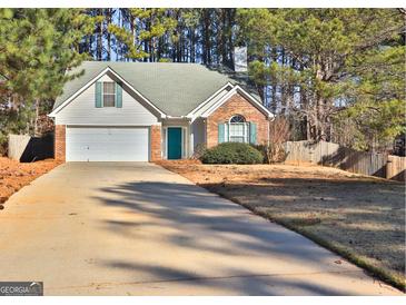 Brick house with attached garage and landscaping at 901 Arbor Way, Mcdonough, GA 30253