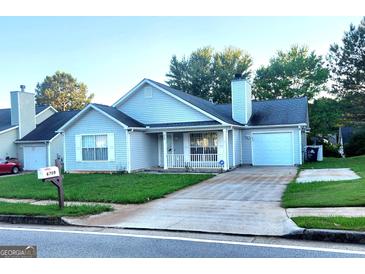 Ranch style home with attached garage and driveway at 6709 Biscayne Blvd, Rex, GA 30273