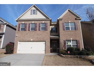 Brick two-story house with a large front yard and two-car garage at 1340 Napa Valley Dr, Lawrenceville, GA 30045