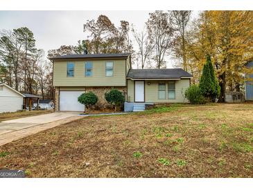 Ranch style home with attached garage and landscaped yard at 2994 Meadow Wood Ct, Lawrenceville, GA 30044