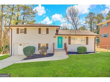 Charming ranch home with a freshly painted exterior and well-manicured lawn at 2629 Preston Dr, Decatur, GA 30034