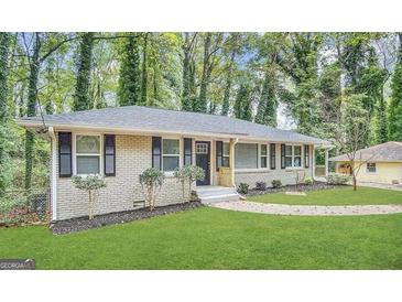 Updated ranch home with landscaped yard and walkway at 2780 Mitchell Dr, Decatur, GA 30032
