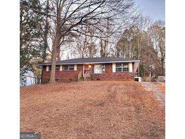 Brick ranch home with a spacious yard at 485 Evergreen Dr, Forest Park, GA 30297