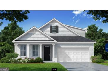 Two-story house with white siding, gray roof, and two-car garage at 749 Myrica Ave # 208, Locust Grove, GA 30248