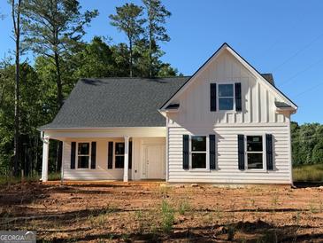 Charming new construction home with board and batten siding, black shutters, and covered front porch at 136 Asa Moseley Rd, Mcdonough, GA 30252