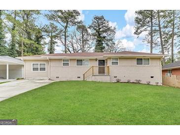 Ranch style home with a well-manicured lawn at 2048 Glendale Dr, Decatur, GA 30032