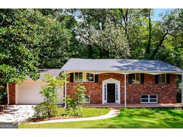 Brick ranch house with attached garage and covered porch at 1139 Pine Mountain Dr, Forest Park, GA 30297