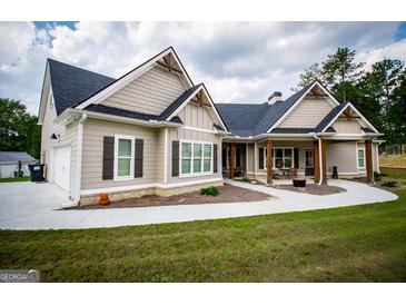 Craftsman style home with large covered porch and landscaped yard at 1291 Pleasant Grove Church Rd, Villa Rica, GA 30180