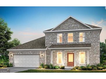 Newly constructed two-story brick home with a covered porch and an attached two-car garage at 214 Kindness Cir, Mcdonough, GA 30252