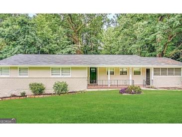 Ranch home with a well-maintained lawn and updated facade at 1271 Avonwood Sw Cir, Atlanta, GA 30311