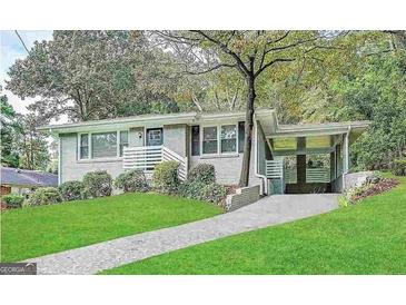 Charming ranch home with a landscaped yard and carport at 1931 Sandringham Sw Dr, Atlanta, GA 30311
